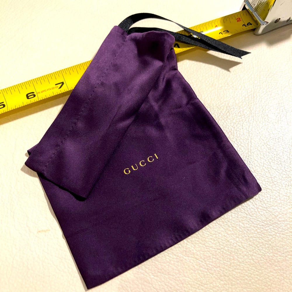 Gucci silk pouch.